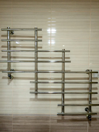 A bathroom with a towel rack on the wall.の写真素材