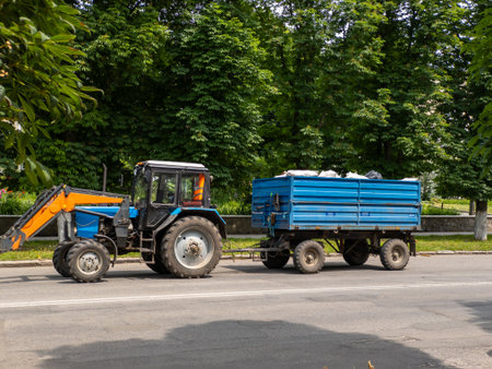 Tractor trailer travels along the road.の写真素材