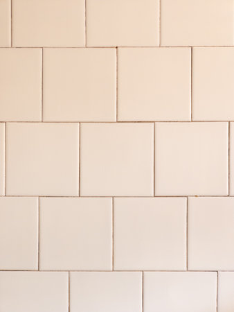 A white tiled wall with a white background.の写真素材