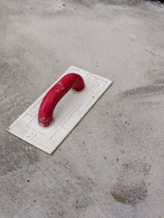 Spatula on a concrete sidewalk background.の写真素材