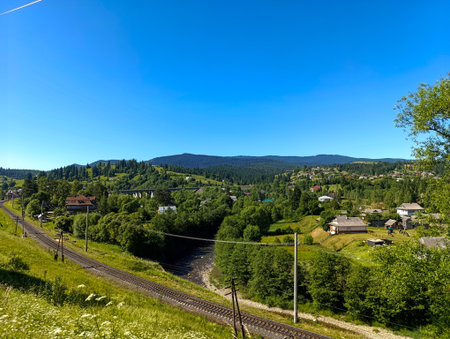 A view of a small town in the middle of a green valley.の写真素材