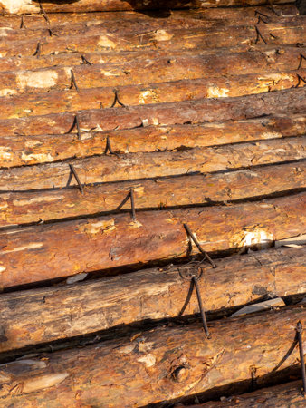 A pile of logs stacked on top of each other.の写真素材