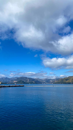 A large body of water with mountains in the background.