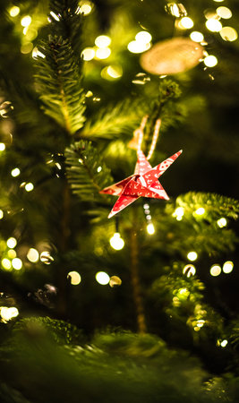 Decorated and illuminated christmas tree, vintage toning closeup macro details