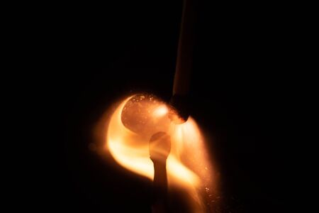 Ignition of match with sparks isolated on black backgroundの写真素材