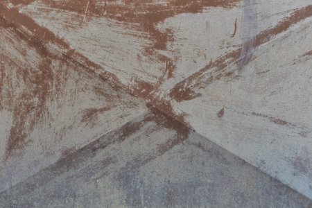 Aged X shaped bent steel plate roofing garage door with faint trace of old paint and rust weathered...