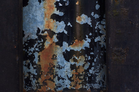 Plate of metal rusty texture with traces of a paint faint color corroded with age