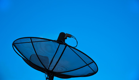 Satellite dish with blue skyの写真素材