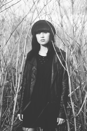Trandy style portrait of young trendy girl in fashionable hatの写真素材