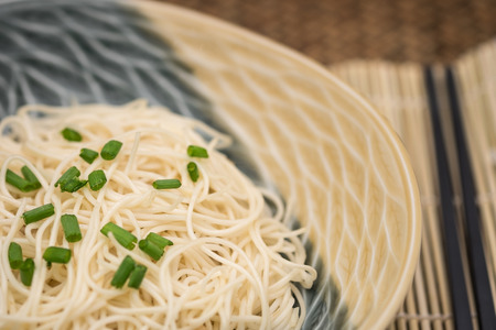 Chinese noodle in ceramic bowl for food backgroundの写真素材