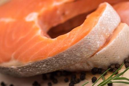 Fresh and raw sliced salmon fish for food preparation backgroundの写真素材