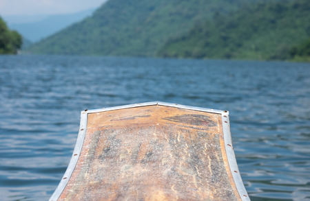 Boat prow with mountain and water scenery for nature backgroundの写真素材
