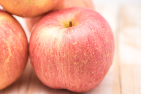 Fresh red apples on wood for a healthy dietの写真素材