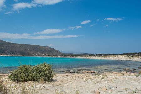 Beautiful beach with teal blue waters shot at Elafonhsos Island, Greece.の写真素材