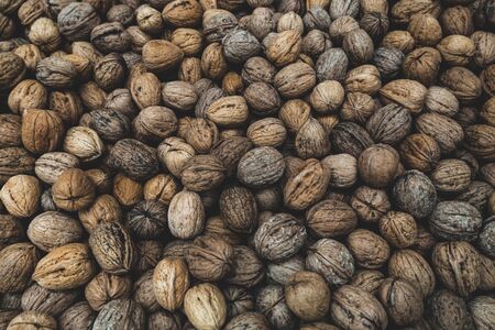 Natural walnut background pattern texture Abstract walnuts heap pattern background. Walnuts in shell.の写真素材