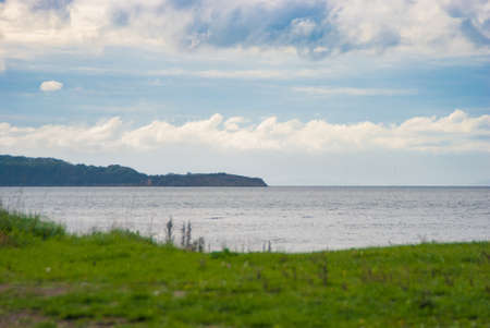 Beautiful seascape, autumn sea, clouds over the water surface, autumn on the seashore.の写真素材