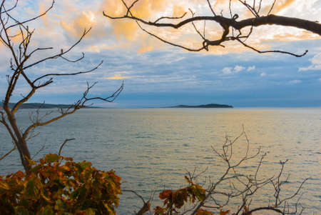 Beautiful seascape, autumn sea, clouds over the water surface, autumn on the seashore.の写真素材