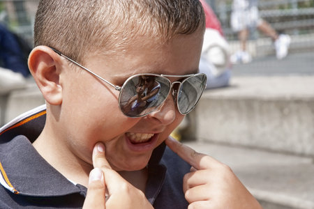 Young boy smiling to something
