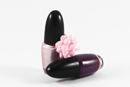 Pink and violet nail polish. Manicure concept. Isolated on white.の写真素材