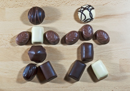 Two chocolate figures on wood plateの写真素材