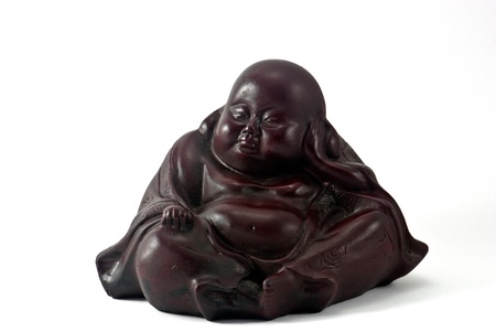 Fat wooden dark brown buddha statue isolated on a white backgroundの写真素材