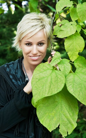 Beautiful woman enjoying a walk in the woodの写真素材