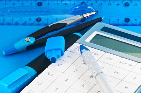 Divers school supplies on blue backgroundの写真素材