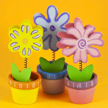 Three painted flowers on orange backgroundの写真素材