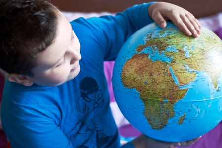 Little boy is playing with globeのeditorial素材