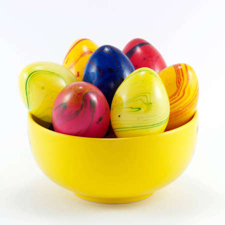 Picture of yellow bowl with easter eggsの写真素材