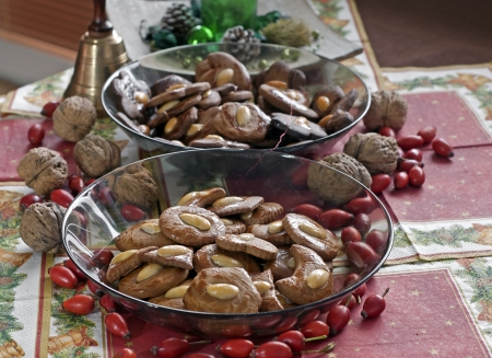 Gingerbread christmas cookies with walnuts and yellow bellの写真素材