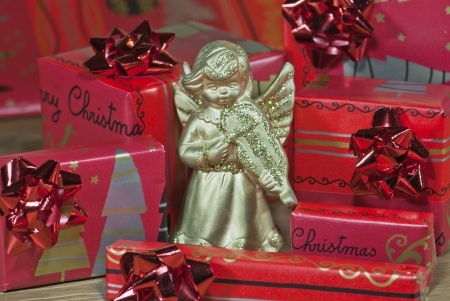 View to gold angel with christmas gifts.の写真素材