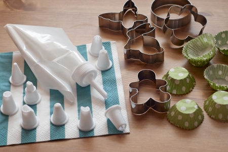 Piping bag set with cookie cutters and cups for cupcakes.の写真素材