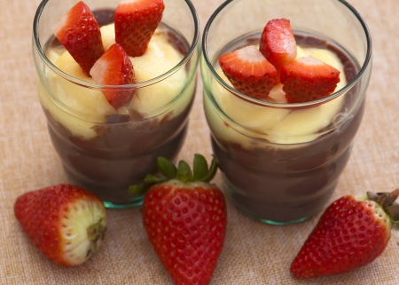 Tasty pudding and strawberries for two people の写真素材