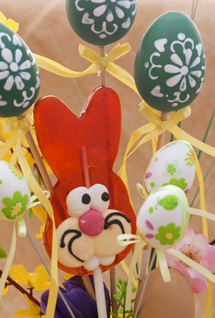 Red easter bunny with painted eggs の写真素材