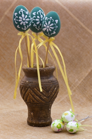 Easter decoration  Colorful eggs and old art vase の写真素材