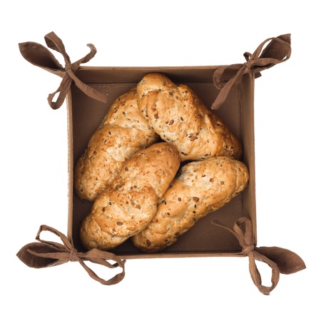 Fresh pastry in a little basket isolated on a white background.の写真素材