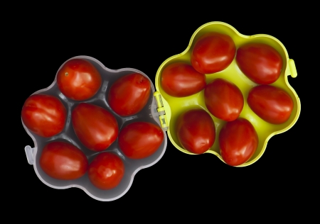 Red cherry tomatoes in a portable container.の写真素材
