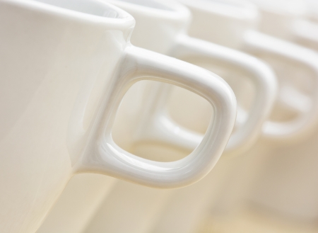 Row of white cups with handles.の写真素材
