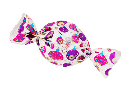 Colorful christmas gift wrapped in a candy shape on a white background.の写真素材