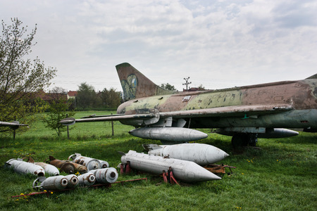 Old fighter plane with a variety of bombs. Military theme.のeditorial素材