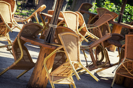 Wicker chairs in the garden restaurant.の写真素材
