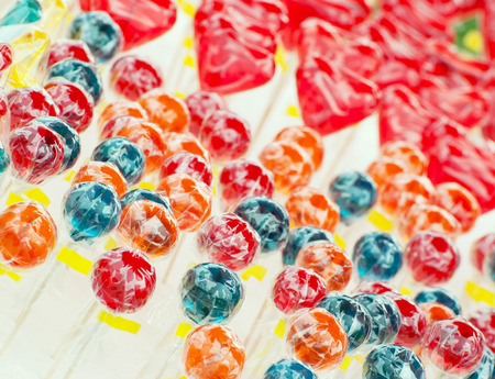 Background of many colorful sweet lollipops.の写真素材