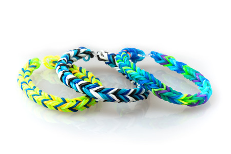 Three style colorful rubber bracelets isolated on a white background.の写真素材