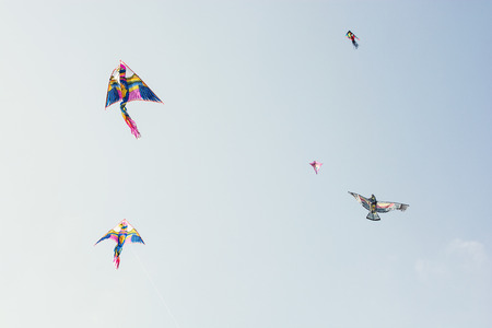 Sky full of colorful flying kitesの写真素材