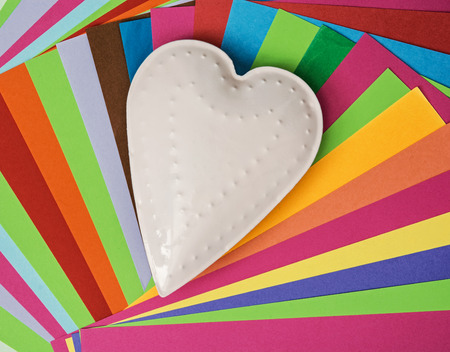 White metal heart on a colorful papers. Valentine's Day.の写真素材