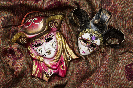 Two masquerade carnival masks on the fashionable background.の写真素材