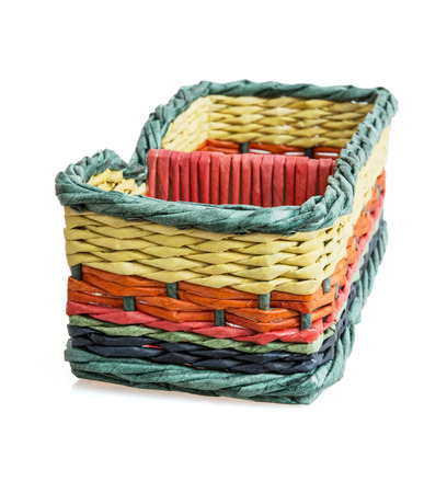 Colorful wicker basket isolated on the white background.の写真素材