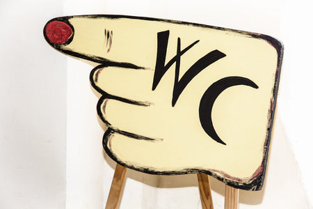 Sign WC on cardboard hand.の写真素材