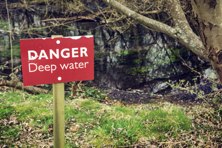 Danger deep water. Warning for tourists.の写真素材